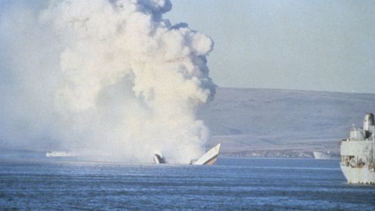 Her back broken, HMS Antelope still smoulders as she sinks in San Carlos Bay during the Falklands War 24 May 1982 CREDIT ROYAL NAVY.jpg