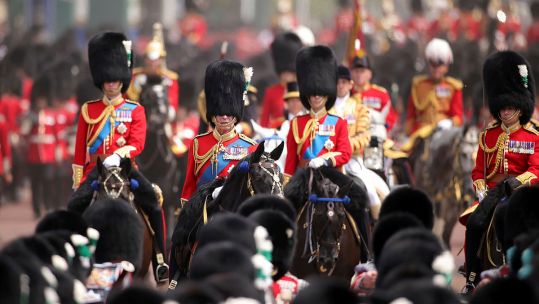 His Majesty The King and senior Royals riding down The Mall trooping the colour