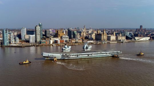 HMS Queen Elizabeth sails up River Mersey into Liverpool 