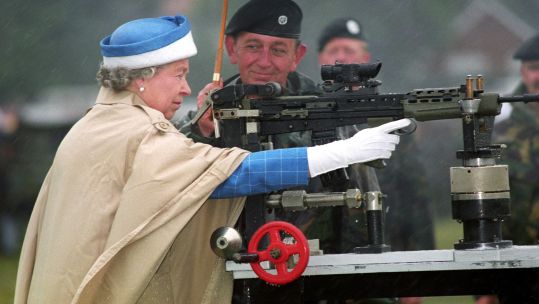 Queen Elizabeth II fires SA 80 rifle during centenary of Army Rifle Association