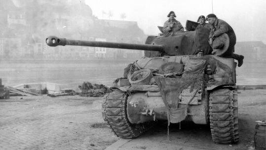 Image ID 2J8BCJH British Sherman Tank, known as the Firefly, patrolling the Meuse at Namur during the Battle of the Bulge in 1944 CREDIT CBW Alamy Stock Photo EXP 231124