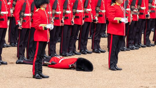 Image ID 2JBH12K a soldier faints during the Trooping the Colour military parade rehearsal to mark Queen Elizabeth's Platinum Jubilee CREDIT Lois GoBe Alamy Stock Photo EXP 231124
