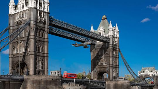 Image ID KG3K0X ARTIST IMPRESSION On 5 April 1968 RAF fighter pilot Alan Pollock flew his Hawker Hunter jet through Tower Bridge in London as a protest about the RAF's 50th anniversary NO REUSE CREDIT Gary Eason Flight Artworks Alamy Stock Photo