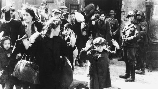 Image ID F7NMA7 Warsaw Jews at gunpoint while SS troops look on in 1943 Holocaust Second World War CREDIT World History Archive AlamyStock Photo EXP 231124