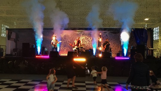 CSE Band Minibar Disaster perform on stage at the RAF Benson Hangar Party