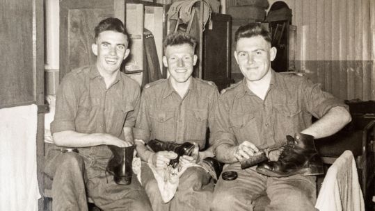 Image ID 2D10C1Y Three army recruits on National Service polishing their boots in their barracks, RAMC, 1956, Ash Vale, Surrey EXP 041123 CREDIT Alamy .jpg