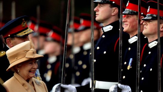 Image ID 2D25593 Queen Elizabeth smiling with Prince Harry during the Sovereign's Parade at the Royal Military Academy in 2006 12042006 CREDIT Reuters, Alamy Stock Photo.jpg