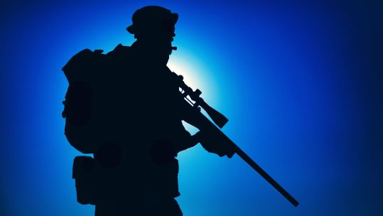Image ID 2F5E2HT ANON Silhouette of army elite forces sniper fighter in boonie hat, carrying backpack DATE UNKNOWN CREDIT Getmilitaryphotos Alamy Stock Photo.png