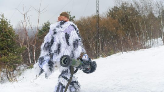 Ukrainian soldier walks with NLAW anti-tank weapon in January (Picture: MYKOLA TYS, SOPA IMAGES/SIPA USA, Alamy).