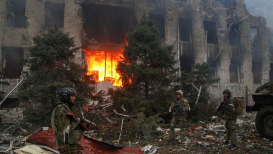 	Image ID 2J5A24N Pro-Russian troops and Chechen special forces unit, in front of destroyed administration building
