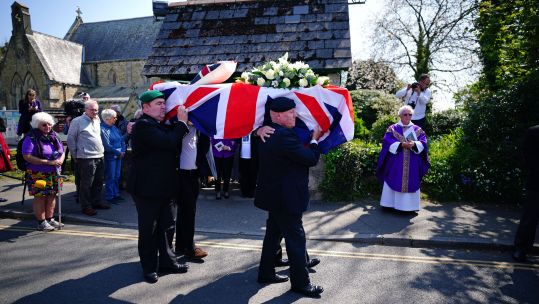 The coffin of 96-year-old Second World War serviceman and Royal British Legion fundraiser Harry Billinge is carried out of St Paul's Church, Cornwall 