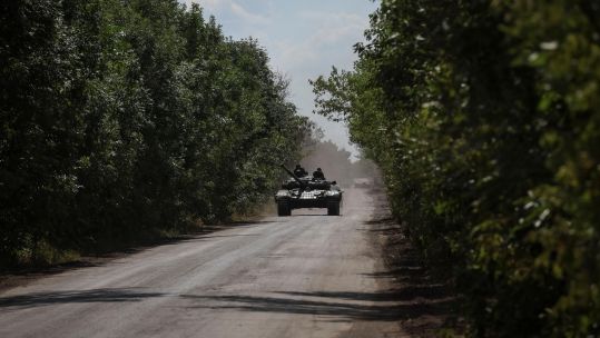 Ukrainian servicemen ride a tank near the frontline, amid Russia's attack on Ukraine, in Donbas region (Picture: REUTERS/Alamy Stock Photo).