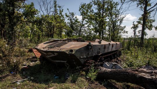 A destroyed armoured personnel carrier seen on a field in Mykolaiv Oblast, Ukraine.(Picture: Alamy)