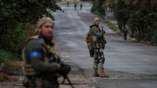 Ukrainian servicemen on patrol, as Russia's attack on Ukraine continues, in the town of Izium, liberated by Ukrainian Armed Forces