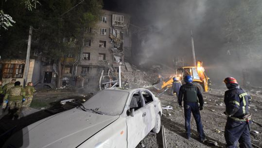 Image ID 2K5T714 Rescuers extinguish the fire caused by a russian missile strike on a residential building, Zaporizhzhia 10102022 CREDIT Ukrinform,Alamy Stock Photo.jpg
