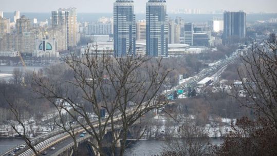 iew of the Dnipro river and the left-bank districts of Kyiv on a frosty winter day