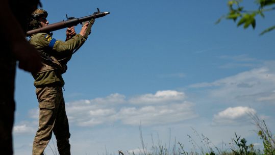 A Ukrainian soldier with 68th Jaeger Brigade fires an RPG at Russian lines a few hundred metres away (Picture: Zuma Press, Inc/Alamy Stock Photo).