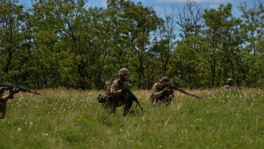 Ukrainian soldiers run training drills outside the city of Kurakhove (Picture: Madeleine Kelly,ZUMA Press Wire, Alamy).