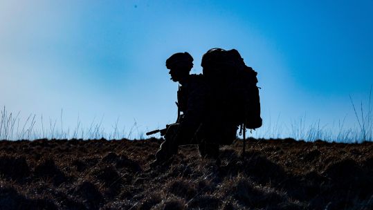 Image ID W26B2T Royal Marine carrying his bergen and rifle through the Sennybridge Training Area 27032019 CREDIT Matthew Lofthouse,Alamy Stock Photo.jpg