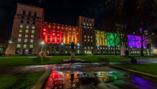 Image of the Ministry of Defence Main Building HQ in London, illuminated with rainbow colours to mark 20 years since lifting of LGB military ban CREDIT MOD 09.01.20.jpg