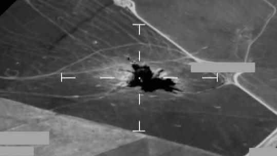Image taken from declassified footage showing an RAF typhoon dropping a Paveway bomb on IS in Northern Iraq