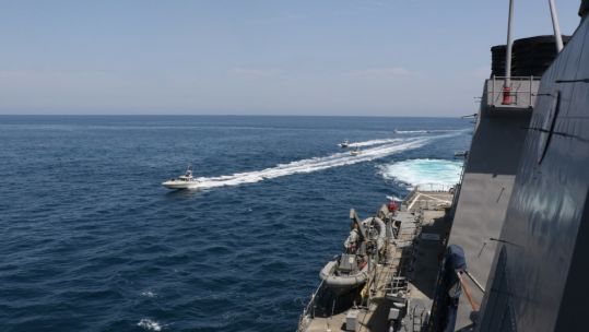 A US Navy photo appears to show Iranian vessels sailing close to US forces (Picture: US Department of Defense).