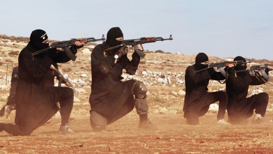 Islamic State militants firing AK-47 rifles