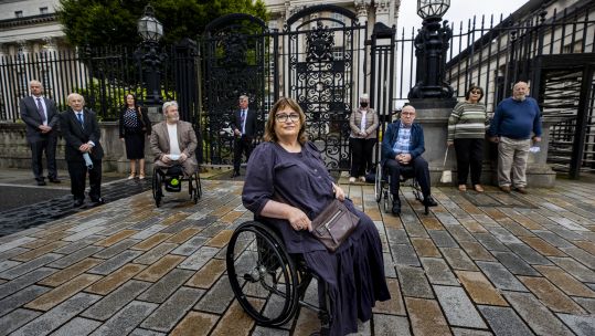 Cover image: Jennifer McNern (centre), joined by legal team and members of the Wave Trauma group outside Belfast High Court (Picture: PA).