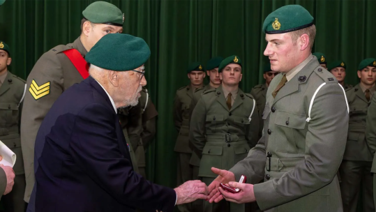 John Eskdale presenting the Commando Medal to Marine James Barback CREDIT ROYAL NAVY