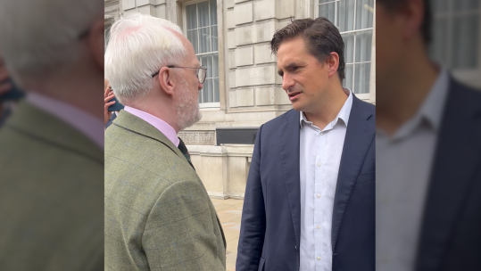 Johnny Mercer during an interaction with Tremaine Cornish, a Royal Marine veteran who was dishonourably discharged from the military for being gay