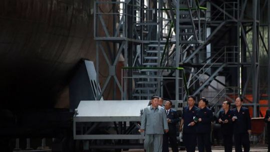 Kim Jong Un visits submarine building site (Picture: KCNA).