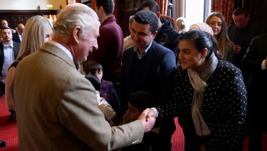 King Charles meets with Afghan interpreter Burhan Vesal and his wife and Narcis on a visit to Aberdeen.