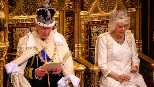 King Charles speaks at the State Opening of Parliament with Queen Camilla by his side (Picture: PA).