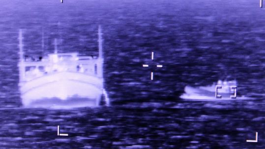 HMS Lancaster's boarding team approaching the suspected dhow (Picture: Royal Navy).