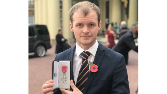 Lance Corporal Connor Roe receives an MBE from the Palace no background