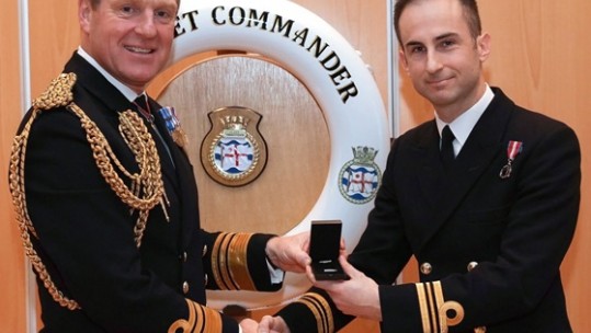 Vice Admiral Ben Key CBE presents Lieutenant Commander Ben Martin with the Queens Commendation for Valuable Service.