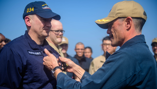 Lieutenant Jonty Paul Sutton being promoted by Captain David Coles CREDIT ROYAL NAVY 291223