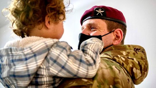 Lt Col Edd Oldfield, CO First Battalion The Royal Gurkha Rifles holds Afghan evacuee Op ALLIED SOLACE in Kosovo.10092021 CREDIT MOD .jpg
