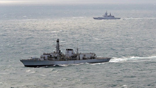 HMS Westminster escorts Russian sub