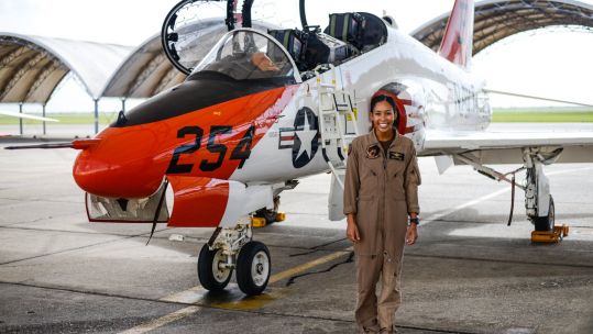 Madeline Swegle 1st known black female TACAIR pilot in US Navy stood next to T-45 Goshawk jet 090720 CREDIT CHIEF OF NAVAL AIR TRAINING (CNATRA) Facebook.jpg