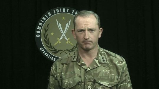 Major General Chris Ghika during a coalition announcement (Picture: US Department of Defense).