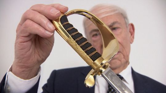 Malcolm Orderver, the 'Godfather of the Sword', inspecting the first King's Sword 
