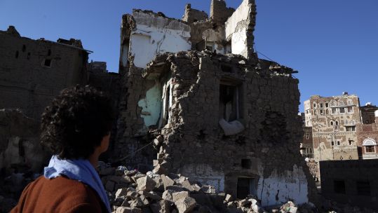 Man looks at a house destroyed in an airstrike in Sanaa, Yemen 090420 CREDIT PA Xinhua News Agency