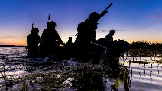 Marines from 45 Commando on an inflatable raiding craft