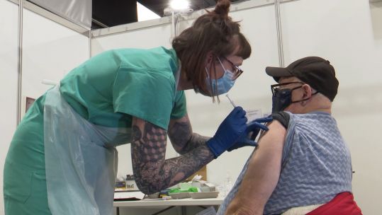 Medic from 3 Medical Regiment based in Preston giving Covid-19 coronavirus vaccine at Aberdeen mass vaccination centre 090221 CREDIT BFBS .jpg