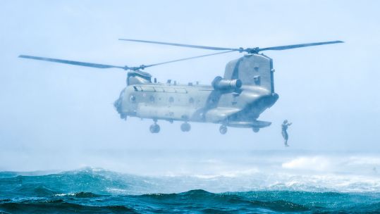 Member of 40 Commando Royal Marines jumps off the back of RAF Chinook during helicasting exercise 270622 CREDIT Royal Navy.jpg