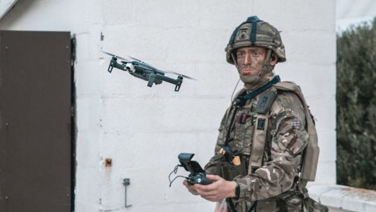 Cover image: Royal Marine flies a drone (Picture: Royal Navy).