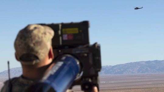 Member of Air Defence Troop, Royal Marines, in action during a mock battle in the Californian desert.