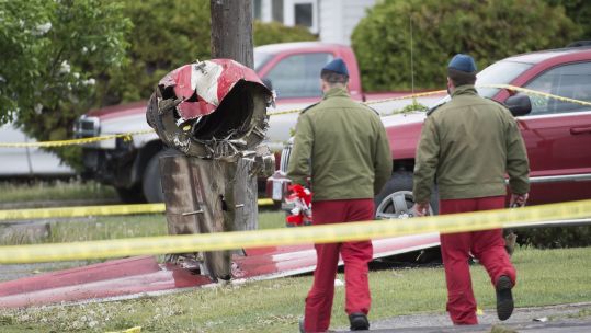Cover image: Members of the Canadian Forces Snowbirds at the scene of the crash in Kamloops (Picture: PA). 