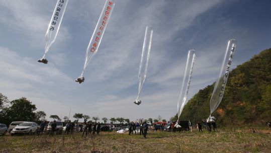 Members of Fighters for Free North Korea, an organisation of defectors from North Korea, send balloons carrying anti-North leaflets across the border from the South Korean border city of Paju
